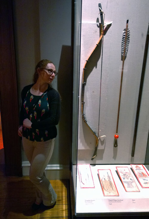 Restored Mongolian recurve bow made from antelope horn, wood, and birch bark (c. 1300 AD). Wife for scale.