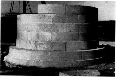 1961 photo of the restoration of the cylinder base of the Leuctra Monument.