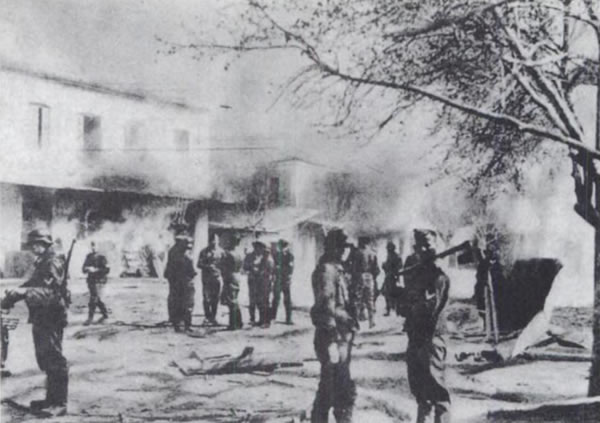 Distomo, Greece. June 10, 1944: Waffen-SS troops watch the village burn. Mazower 1995, 213.